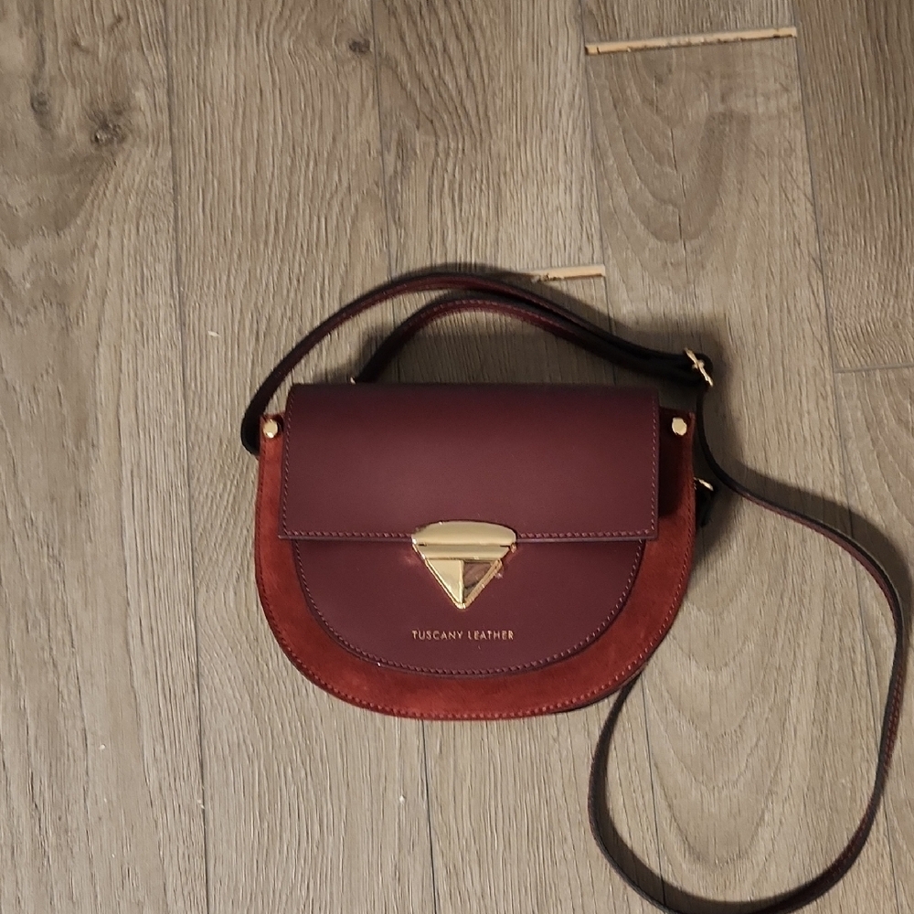 Burgundy Crossbody Bag with Circular Shape and Gold Clasp